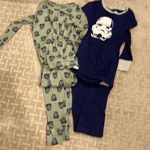 2 Pairs of licensed boys Star Wars pajamas.